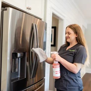Team Member Cleaning Fridge